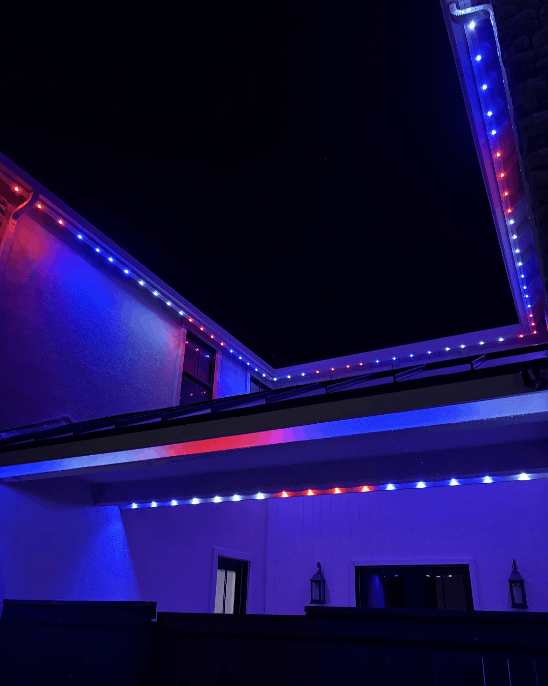 Close-up of bluEmber eave lights in a red, white, and blue patriotic pattern