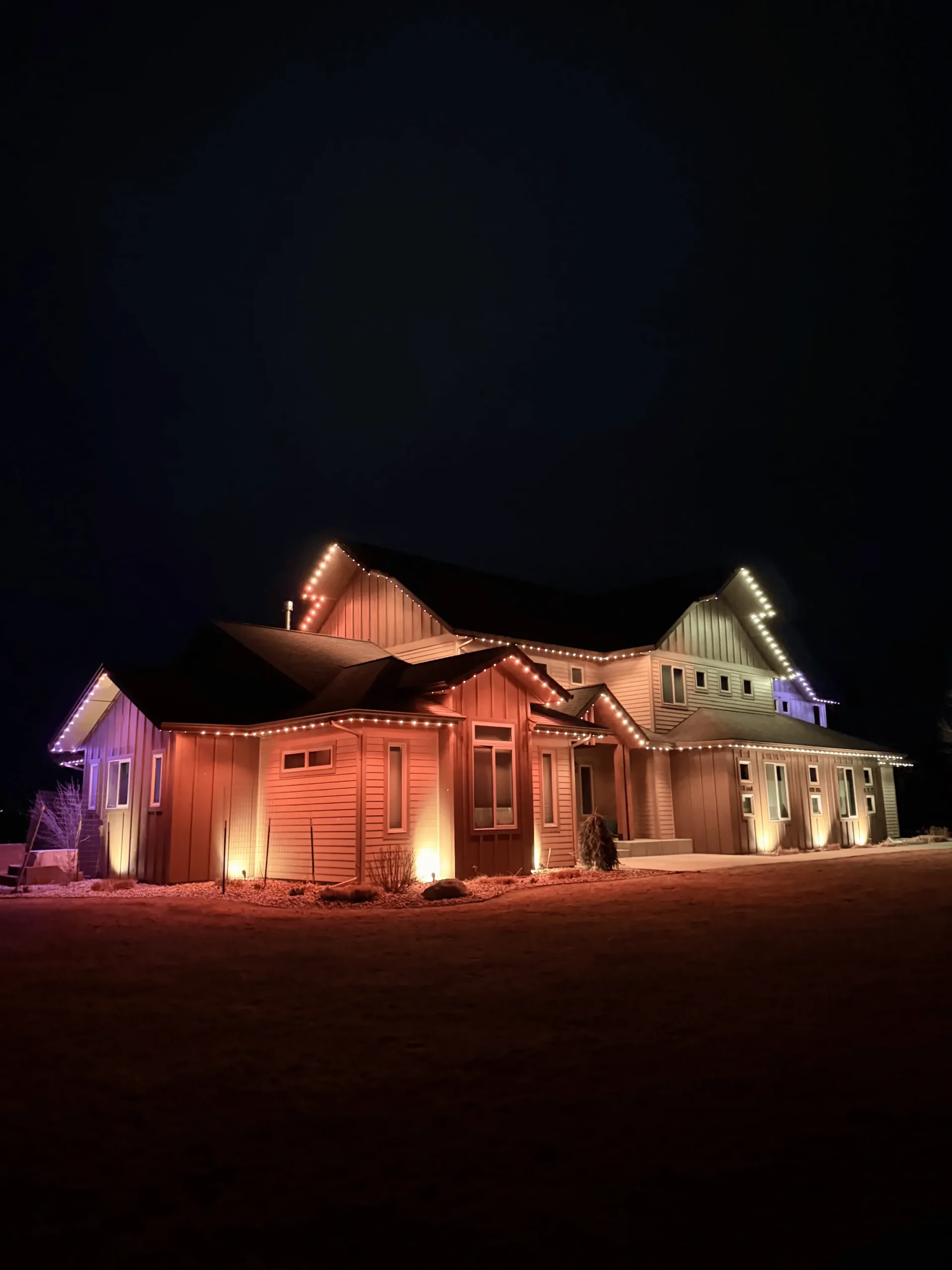 bluEmber night install with warm-white eave lighting